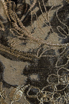 Close-up of the Sarvin Golden & Black Italian Lace Pouch Bag, highlighting gold metallic floral embroidery, detailed stitching, and luxurious texture.