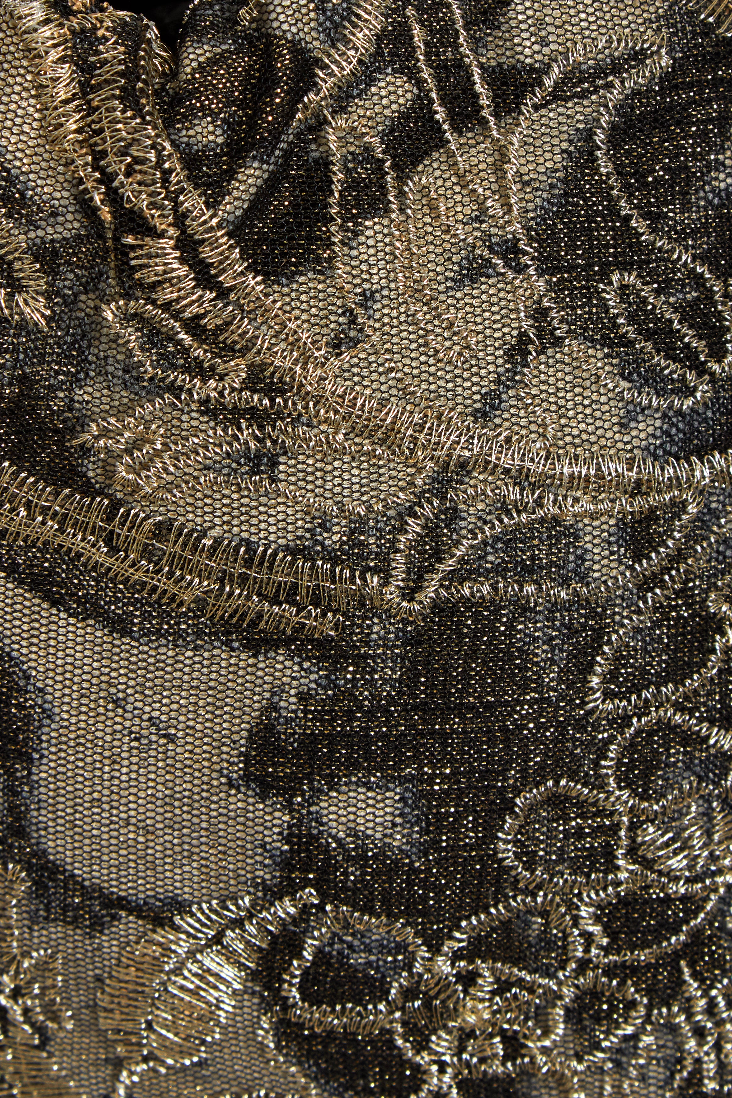 Close-up of the Sarvin Golden & Black Italian Lace Pouch Bag, highlighting gold metallic floral embroidery, detailed stitching, and luxurious texture.
