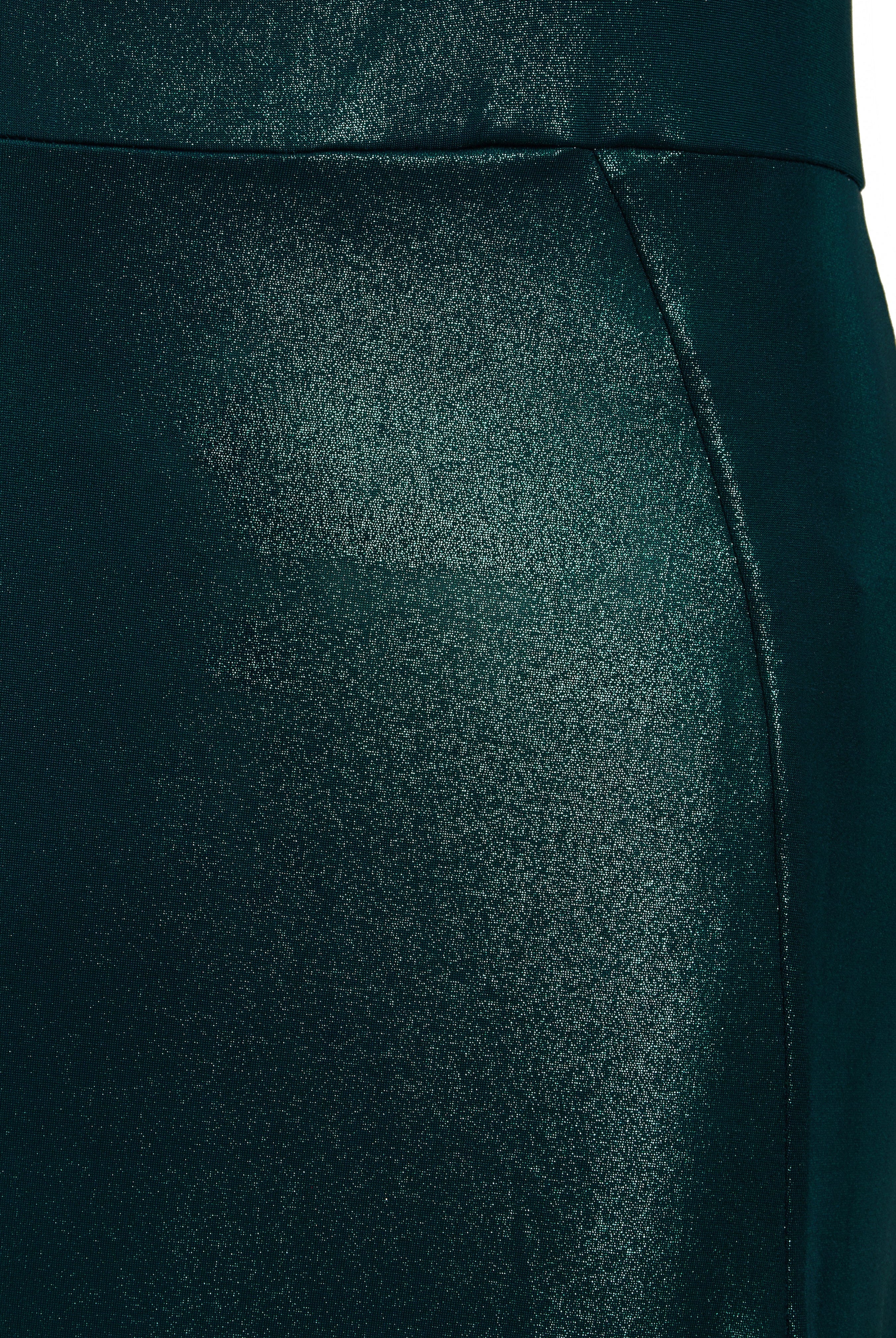 A close up of a woman's Sarvin Green Cut Out Side Dress.