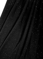 The Sarvin Sparkly Black Twist Front Dress features black fabric with fine silver flecks for a starry, glittery effect—perfect for evening wear. Elegant draping adds to its sophisticated style.