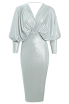 The Sarvin Batwing Sleeve Midi Dress features a silver metallic finish, long batwing sleeves, deep V-neckline, gathered waist draping, fitted skirt, and ruched upper for a chic bodycon party look.