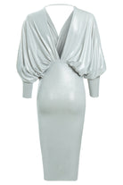 The Sarvin Batwing Sleeve Midi Dress is a silver metallic bodycon featuring draped batwing sleeves, a deep V-neckline, fitted waist, open back with a chic horizontal strap, and a subtle sheen. Perfect for parties.