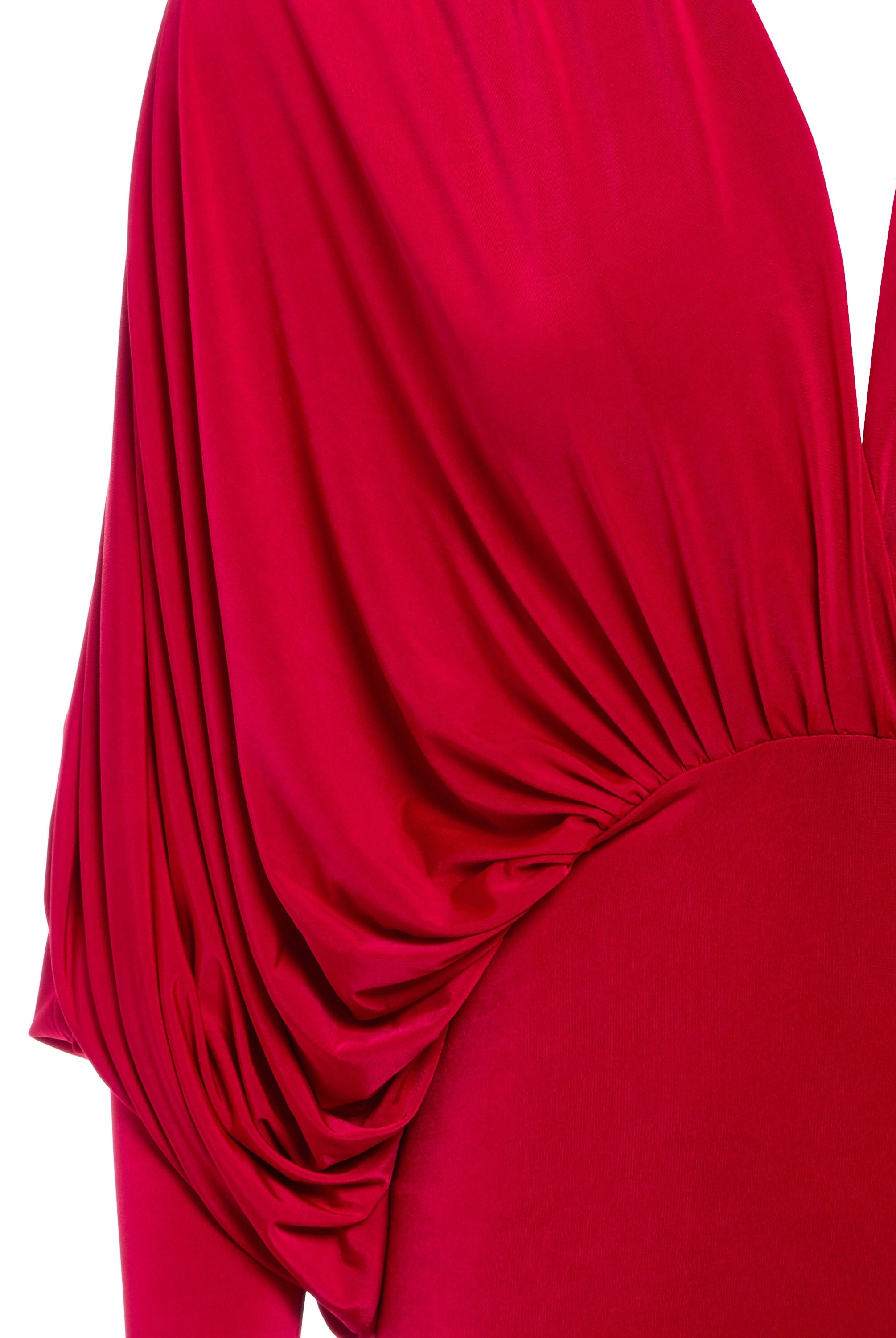 a woman in a Sarvin Red Batwing Dress with a sleeveless top.