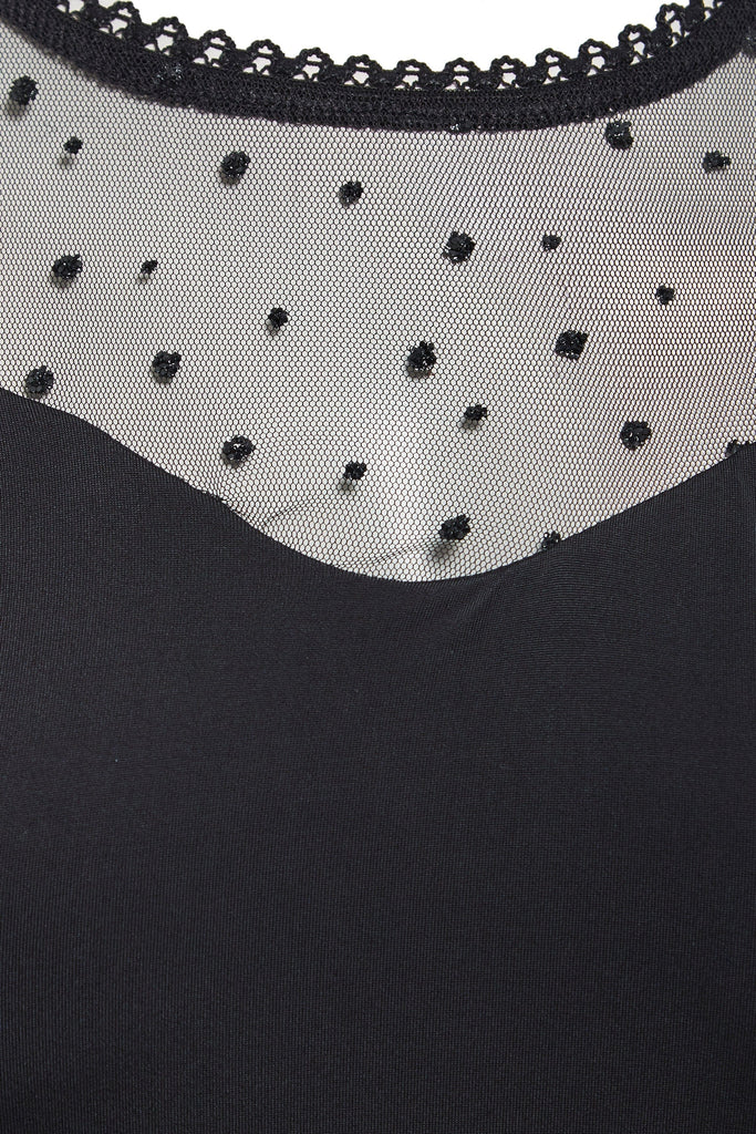 A close up of a Sarvin Long Sleeve Glitter Mesh Bodysuit with beading.