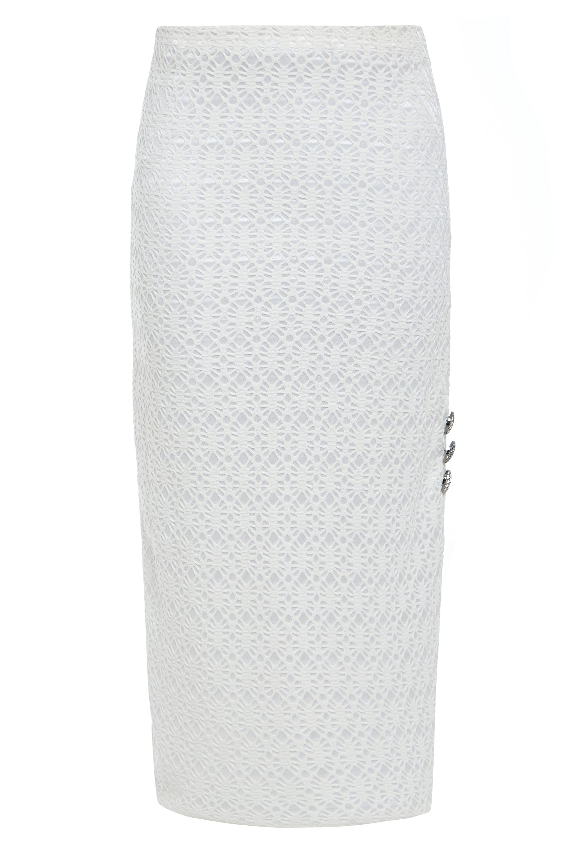 The Sarvin White Bodycon Lace Skirt is a high-waisted, knee-length skirt handmade in the UK, featuring a textured floral lace pattern and three decorative buttons on the right side.