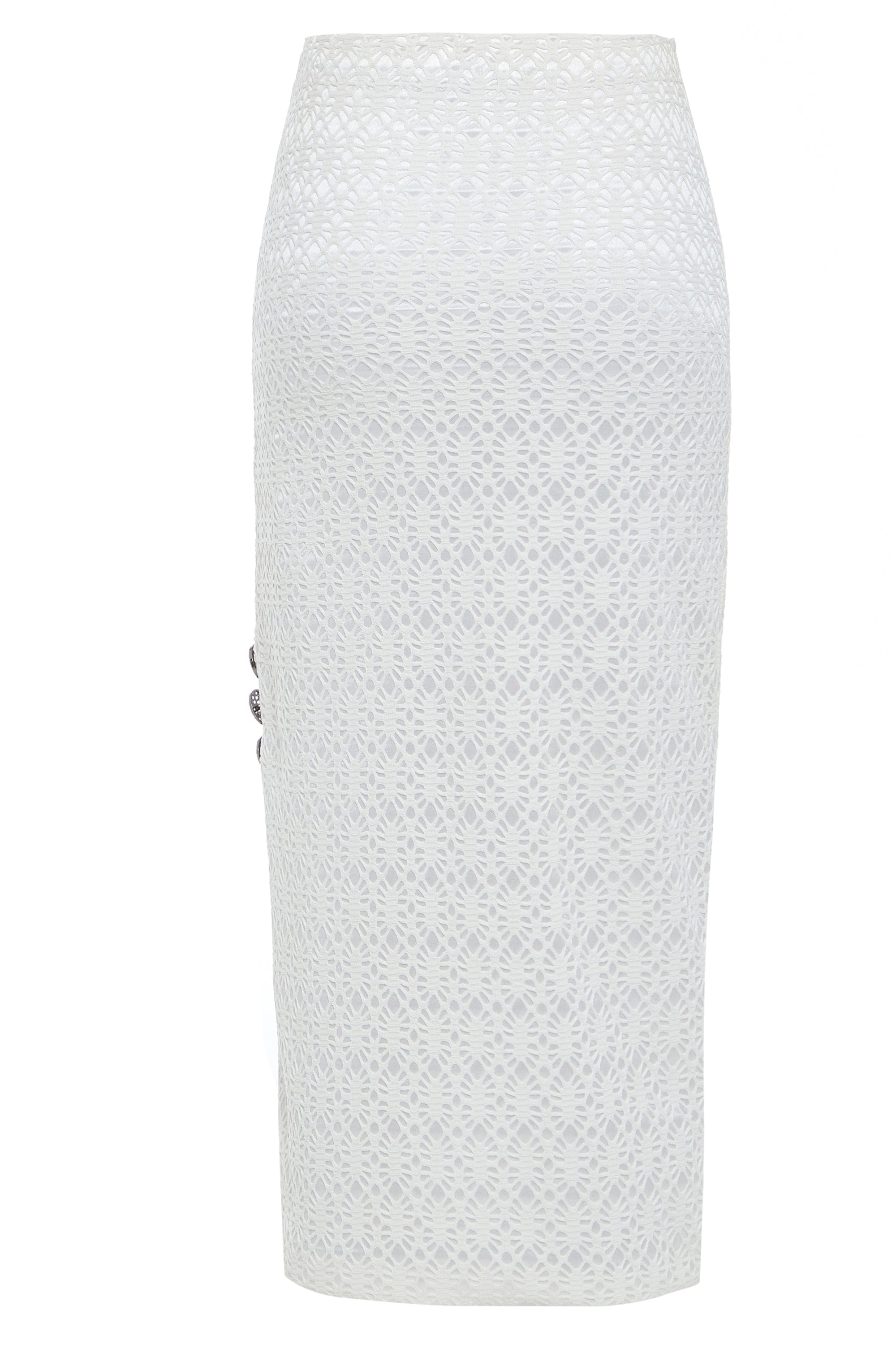 The Sarvin White Bodycon Lace Skirt is handmade in the UK with a knee-length, high-waisted pencil fit, featuring an intricate circular lace overlay and decorative side buttons for a chic finish.