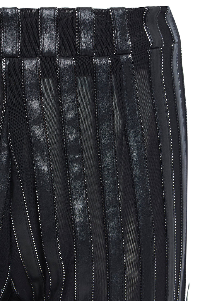 A close up of a woman's Sarvin Flare Trousers In Metallic Stripe.