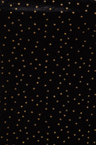 Inspired by Sarvin's Black Polka Dot Dress, this black background with evenly spaced gold dots echoes chic polka dot style—ideal for creating a stunning wedding guest dress.
