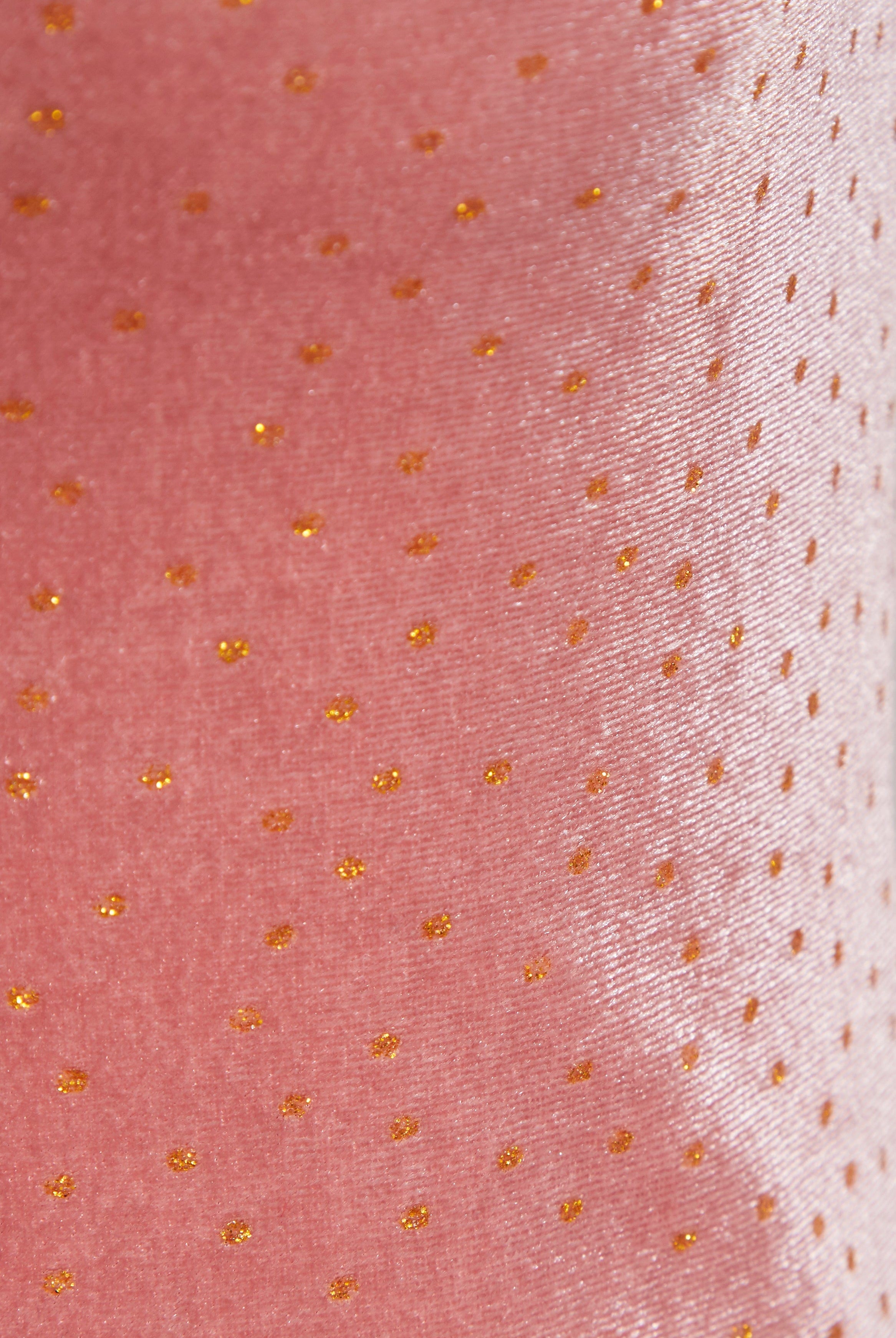 Close-up of the Sarvin Pink Velvet Polka Dot Dress, featuring a shiny texture with evenly spaced small gold dots—ideal for elegant evening occasions.