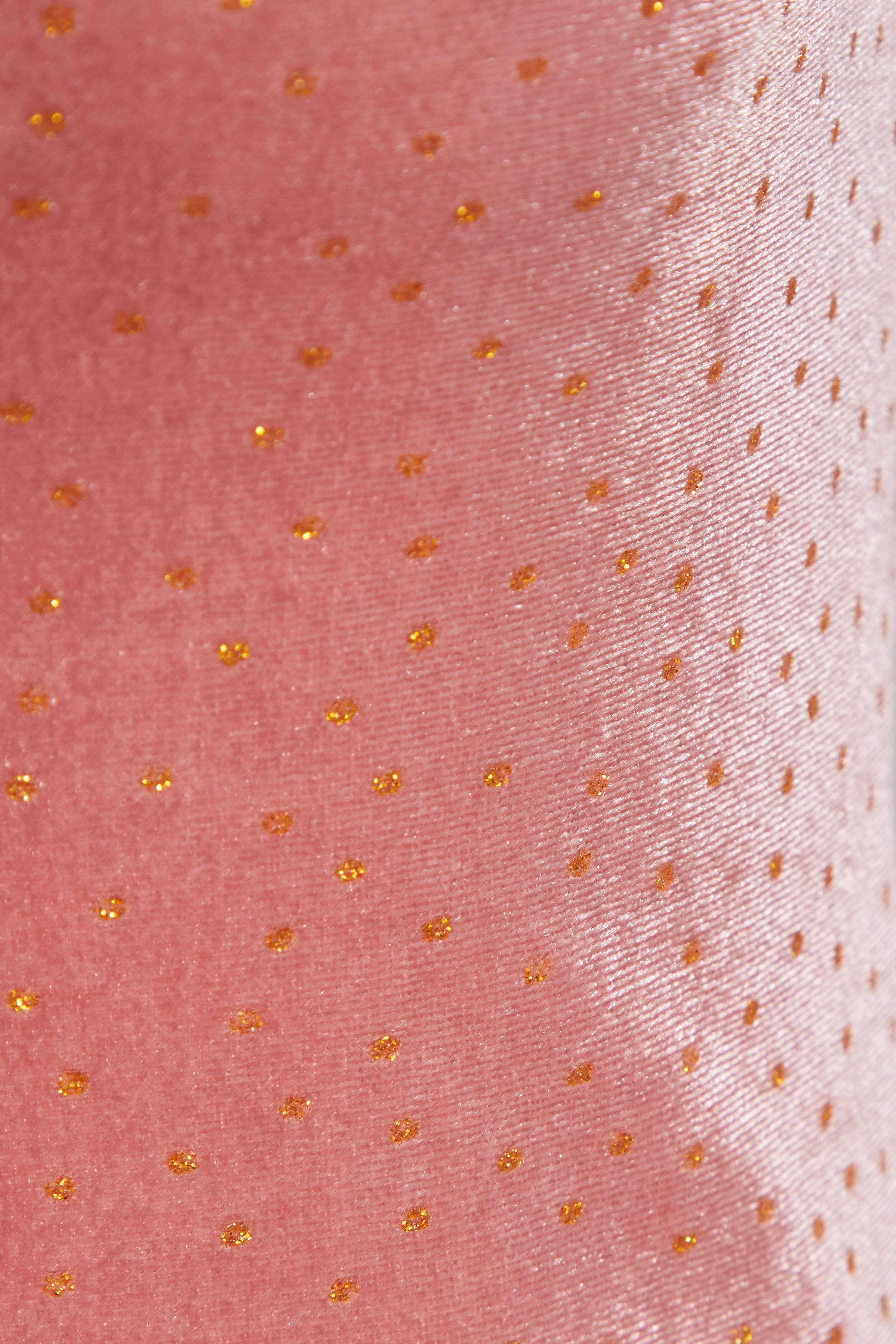Close-up of the Sarvin Pink Velvet Polka Dot Dress, featuring a shiny texture with evenly spaced small gold dots—ideal for elegant evening occasions.
