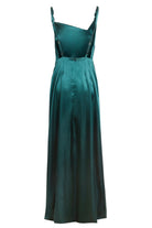 An Emerald Green Maxi Dress by Sarvin with wide legs, adjustable shoulder straps, and a slightly asymmetrical neckline evokes black-tie elegance, displayed on a white background.