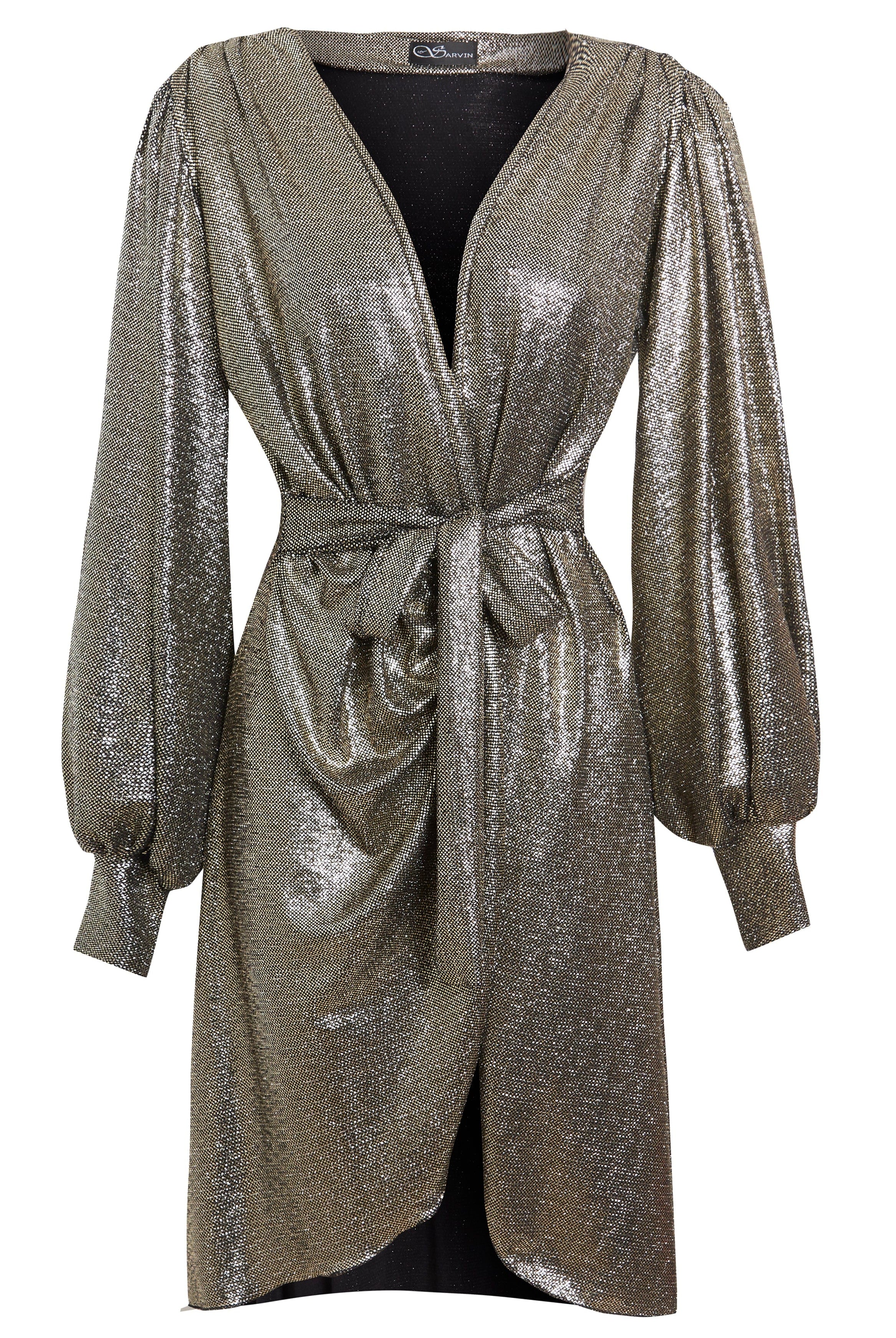 The Sarvin Long Sleeve Sequin Wrap Dress is a knee-length metallic silver evening dress featuring a deep V-neck, gathered waist with matching belt, draped front, subtle puffed sleeves, and shimmering textured fabric for a radiant look.