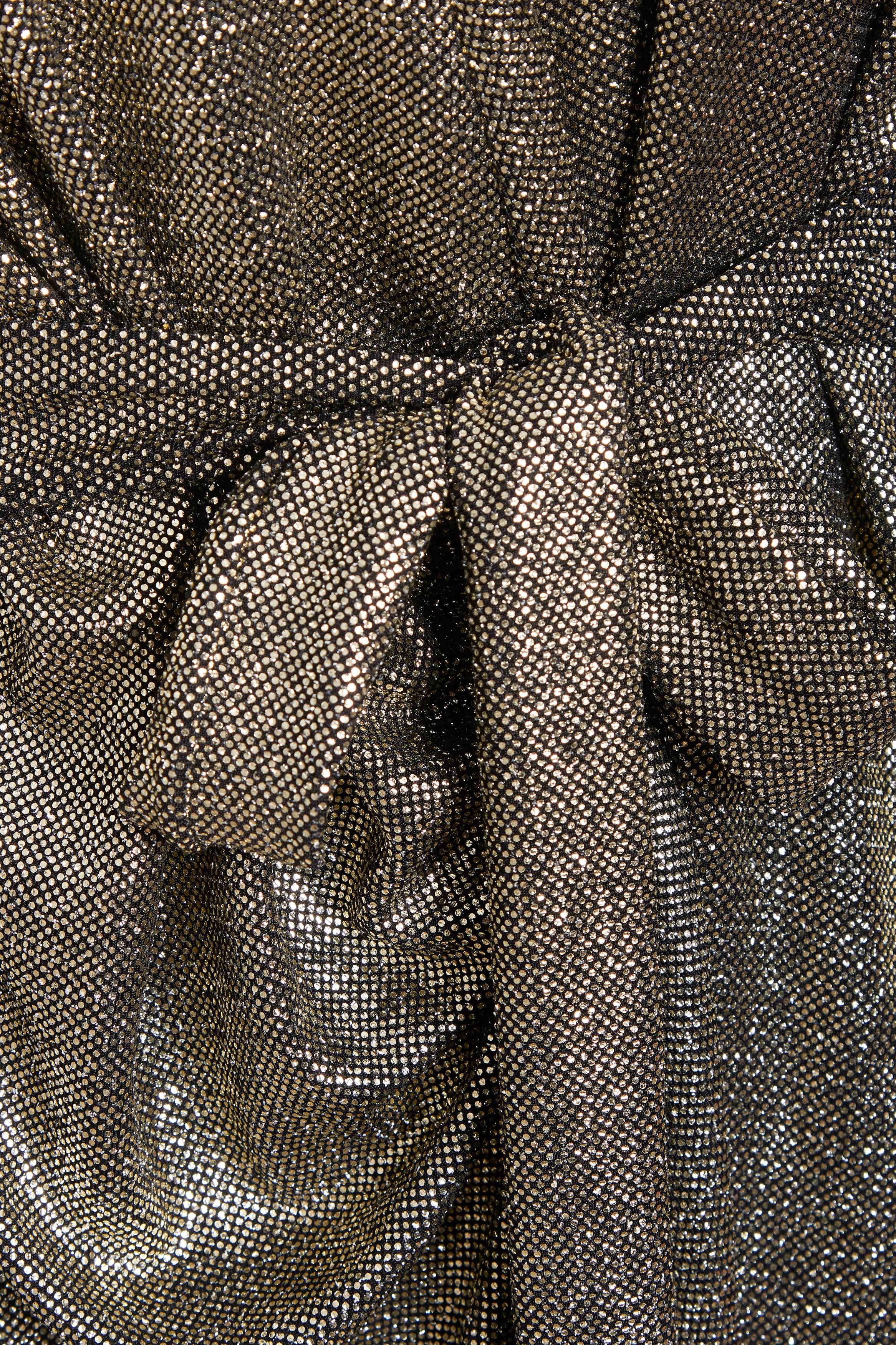 Close-up of Sarvin's Long Sleeve Sequin Wrap Dress, featuring a shiny, mesh-like gold fabric with a central knot detail—perfect for glamorous evening wear.