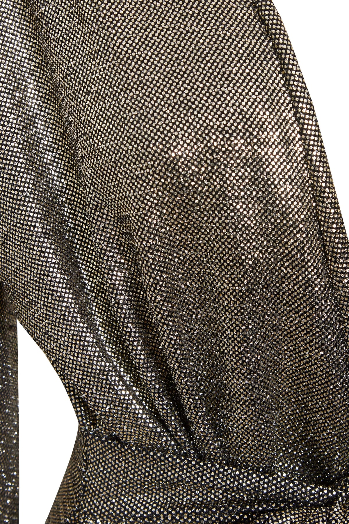 Close-up of Sarvin's Long Sleeve Sequin Wrap Dress, featuring metallic, shimmering fabric with a fine mesh pattern draped at the waist. The material reflects light beautifully, creating a textured effect perfect for evening wear.