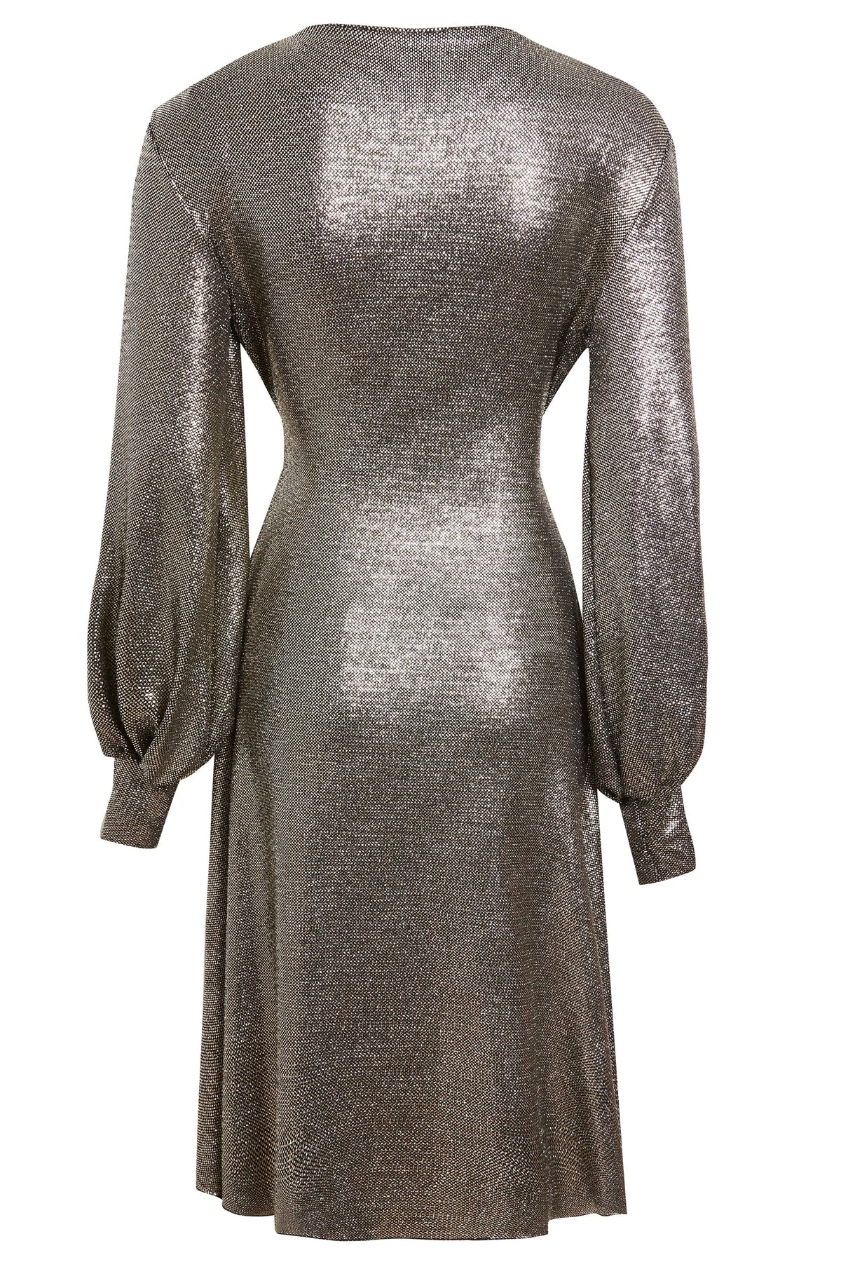 The Sarvin Long Sleeve Sequin Wrap Dress features a metallic silver finish, fitted waist, flared skirt, and loose cuffed sleeves. Its shiny, textured fabric makes it ideal for special occasions. Shown here from the back view.
