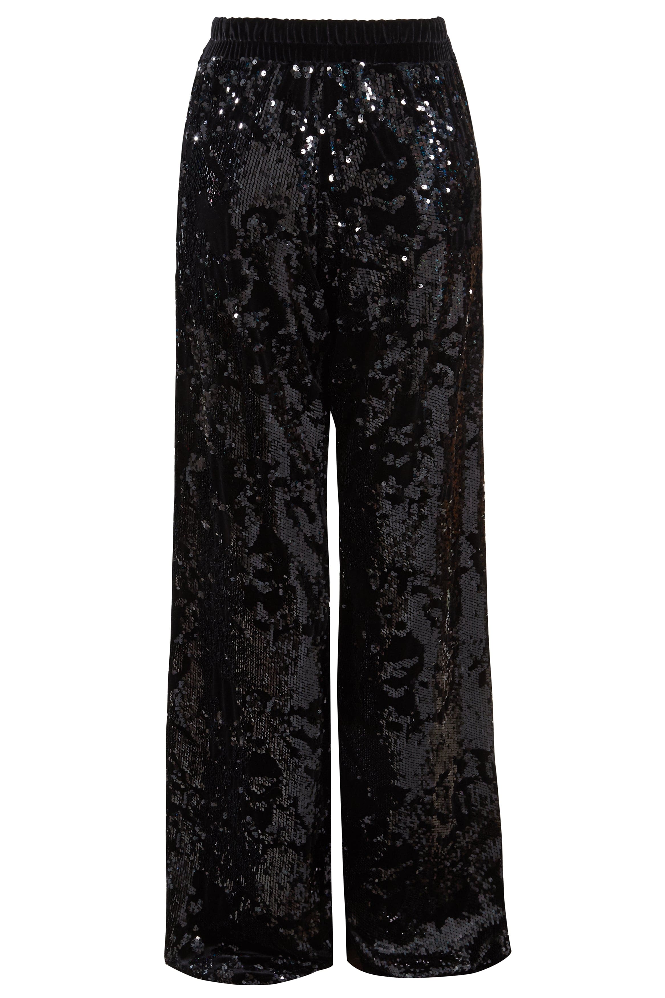 Sarvin’s Sequin Velvet Flared Trousers are black, handmade in the UK, and feature a relaxed fit with an elastic waistband. Covered in glossy sequins for a reflective look, they’re the perfect party piece.