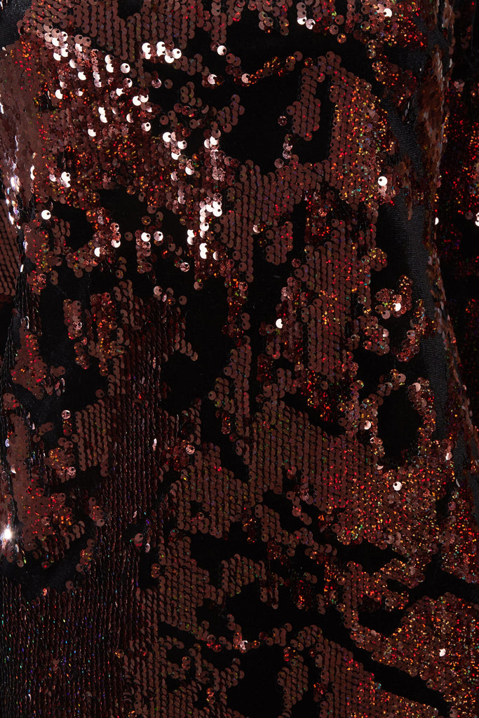 a close up of a Sarvin Sparkly Brown Tie Back Top.
