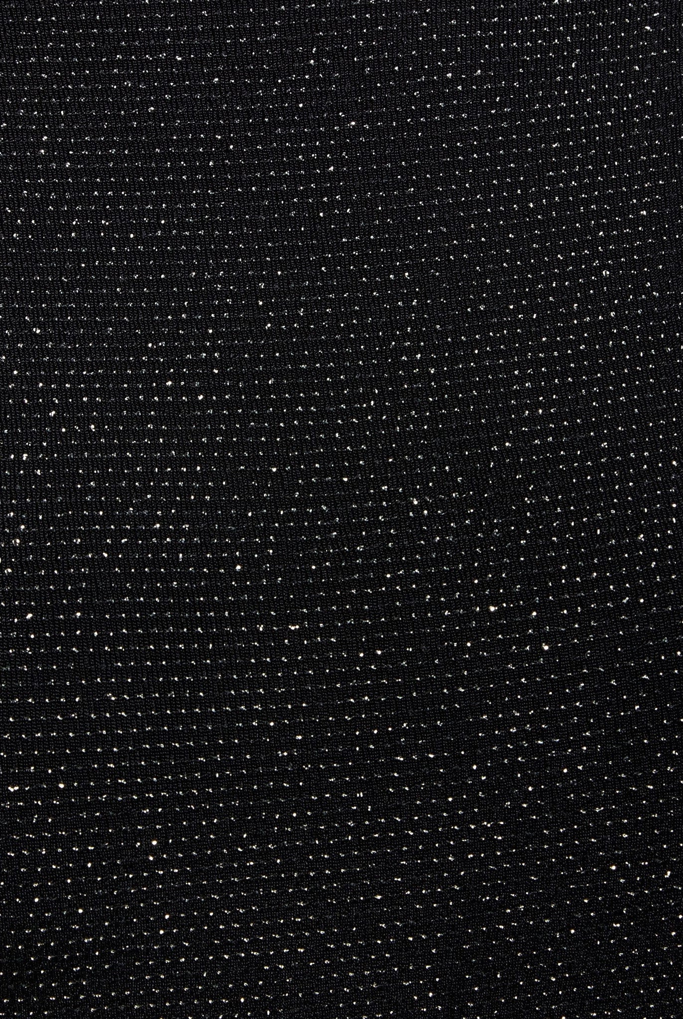 a close up of a Sarvin Black Cowl Back Gown with dots on it.