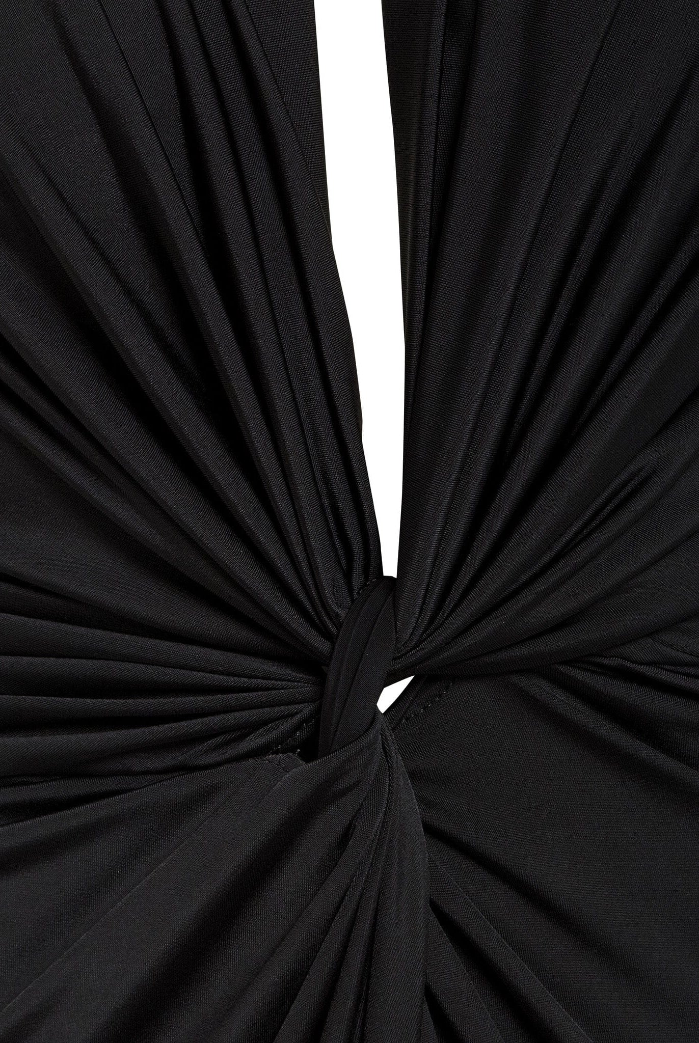 Close-up of black fabric gathered and twisted into a central knot, creating chic folds and draping—a stylish detail on the Sarvin Black Knot Front Midi Dress.