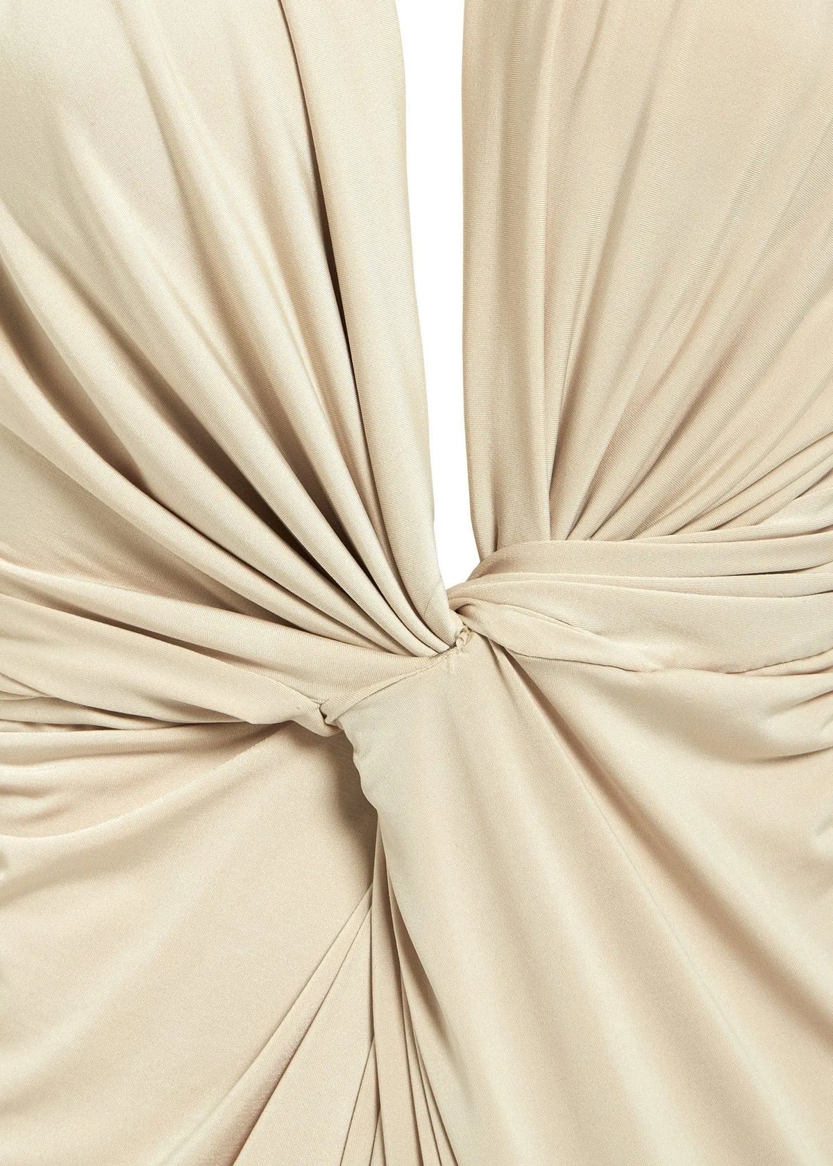Close-up of smooth, slightly shiny beige fabric gathered and twisted at the center, creating soft folds—a detail featured in the Sarvin Low Cut Midi Dress.