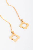 The Sarvin Clover Shape 18K Gold Threader Earrings feature two dangling, open-centered flower pendants on a gold chain, shown against a white background.