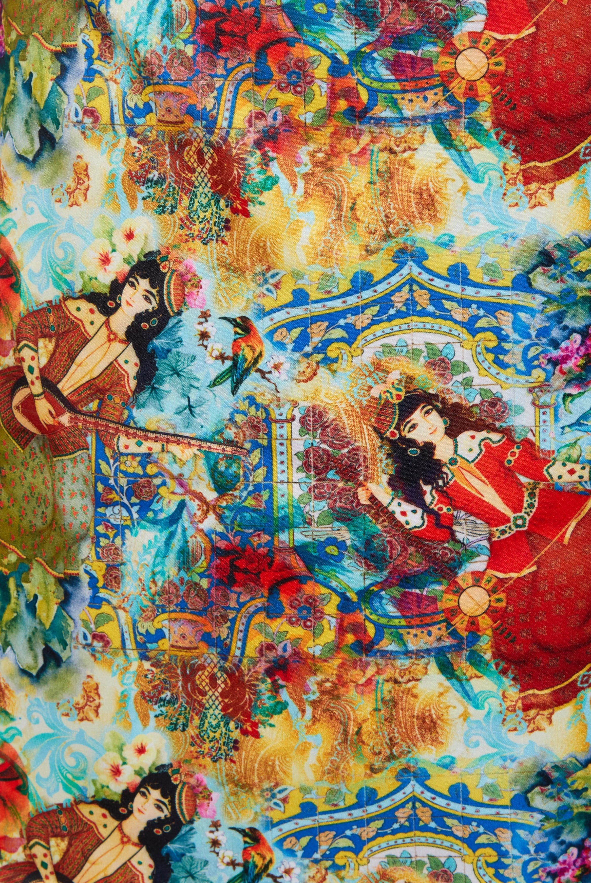 The Sarvin Persian Printed Mini Skirt showcases a vibrant, detailed design featuring illustrated women in elaborate dresses, birds, flowers, and ornate patterns in red, blue, green, and yellow hues.