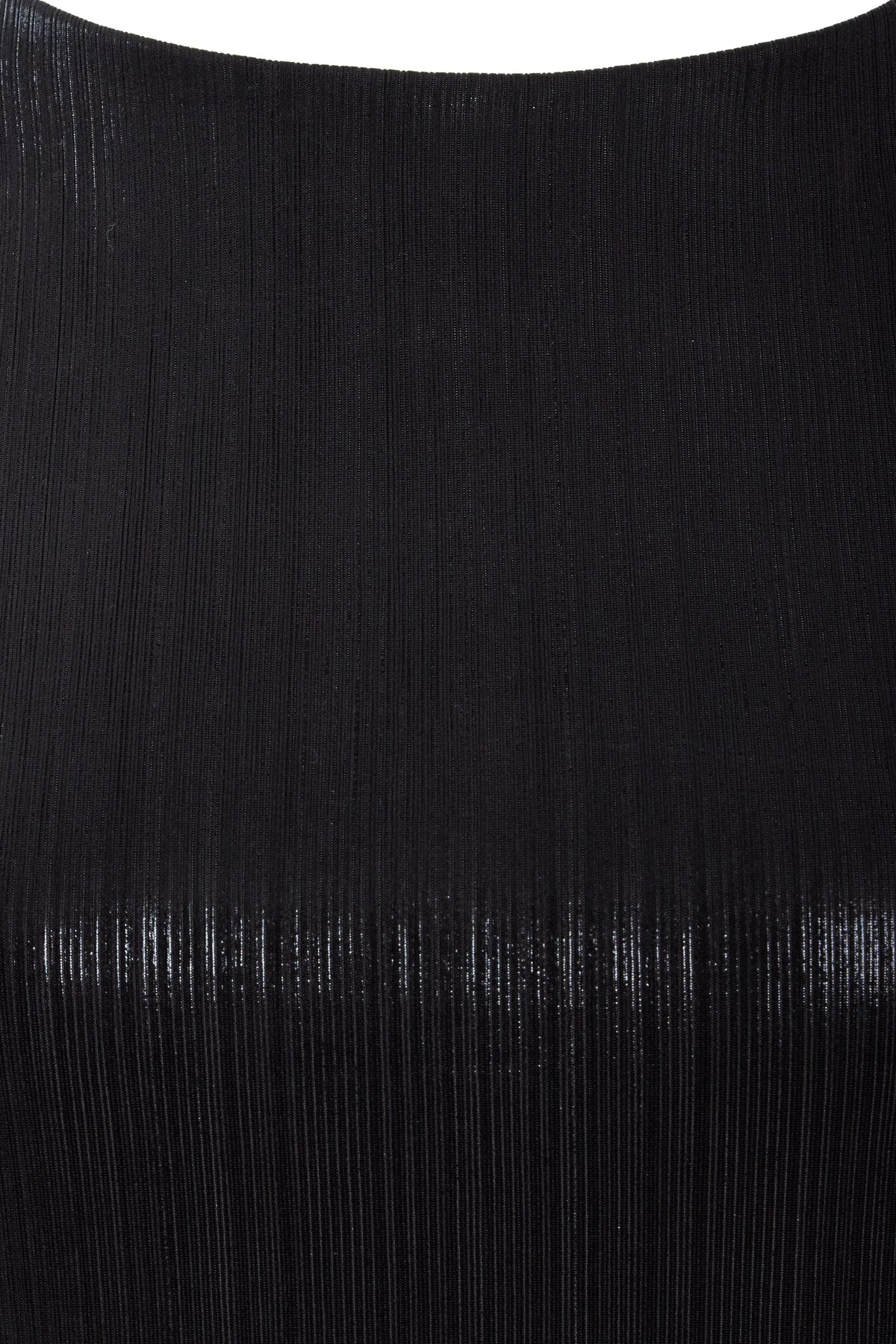 Close-up of the Sarvin Black Cut-Out Maxi Dress reveals finely ribbed fabric with a subtle sheen, vertical textured lines, and a smooth, curved upper edge—perfect for an elegant evening look.