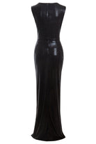 The Sarvin Black Cut-Out Maxi Dress is a sleeveless, floor-length gown with a subtle sheen, fitted at the waist and slightly flared at the hem, shown from the back.