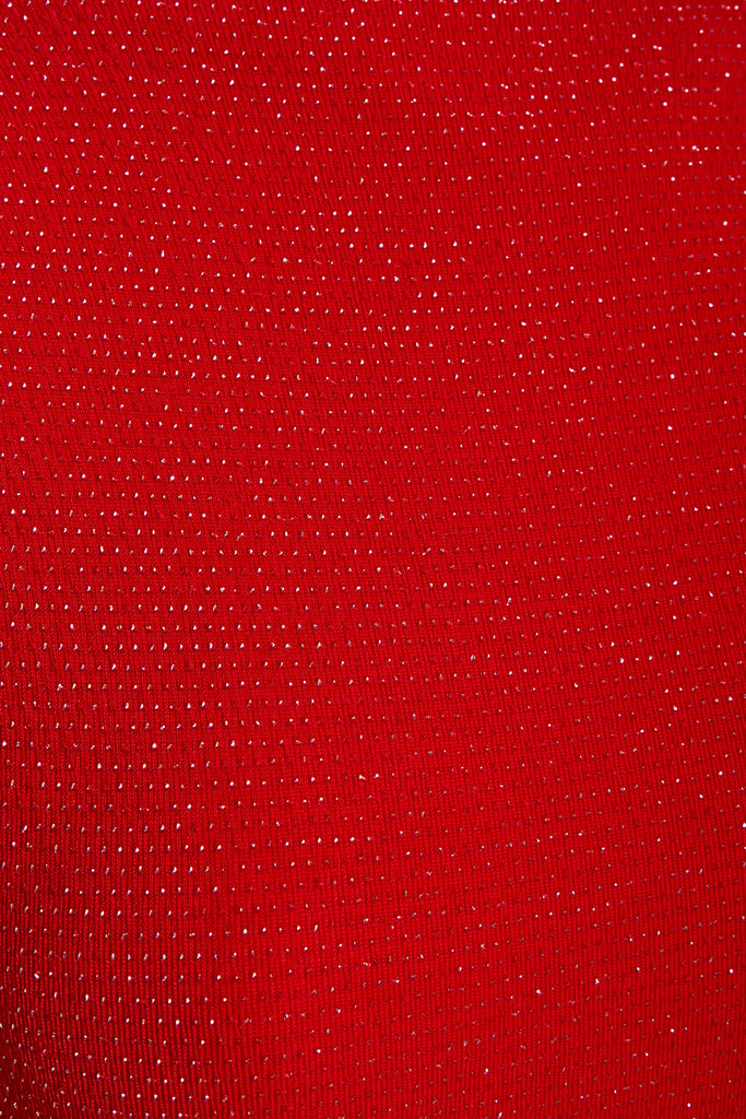 a close up of a Sarvin Red Cowl Back Gown.