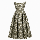 The Tala Corset Midi Dress by Sarvin features a sleeveless, fitted bodice and flared skirt with an abstract green and white floral print. A slightly off-the-shoulder neckline adds structure to this elegant midi silhouette.