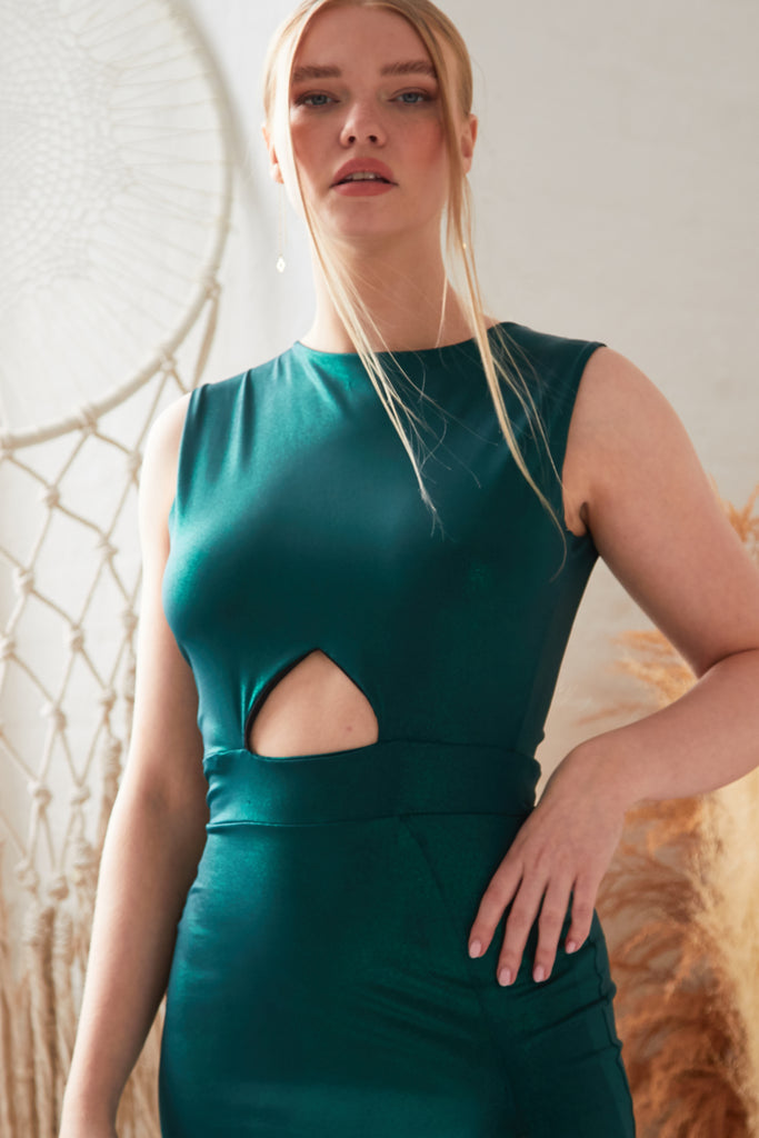 Sarvin's Green Cut Out Side Dress is an emerald cut out midi dress.