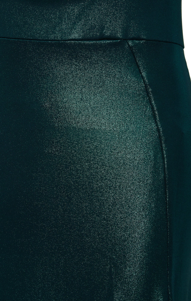 A close up of a woman's Sarvin Green Cut Out Side Dress.