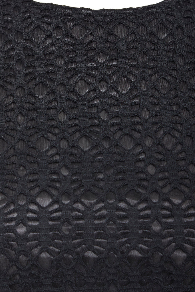A close up of a Sarvin Backless Black Dress.