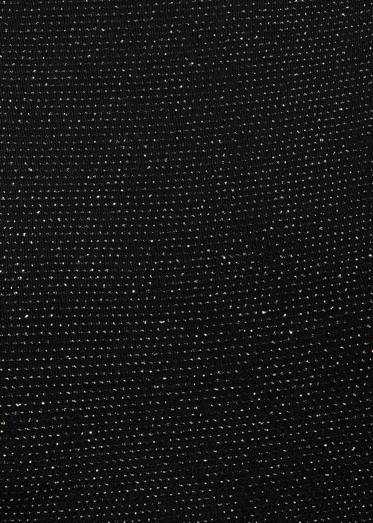 a close up of a Sarvin Black Cowl Back Gown with dots on it.