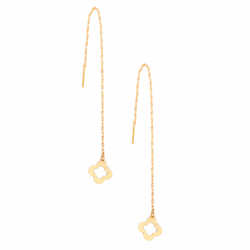 a pair of Sarvin Clover Drop Earrings Gold with a flower on them.