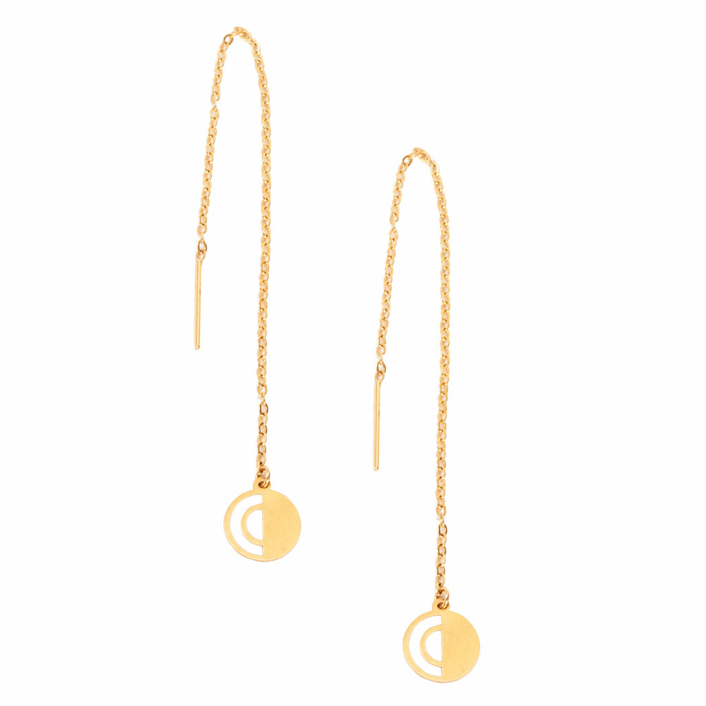 a pair of Sarvin Gold Threader Earrings with a circular charm.