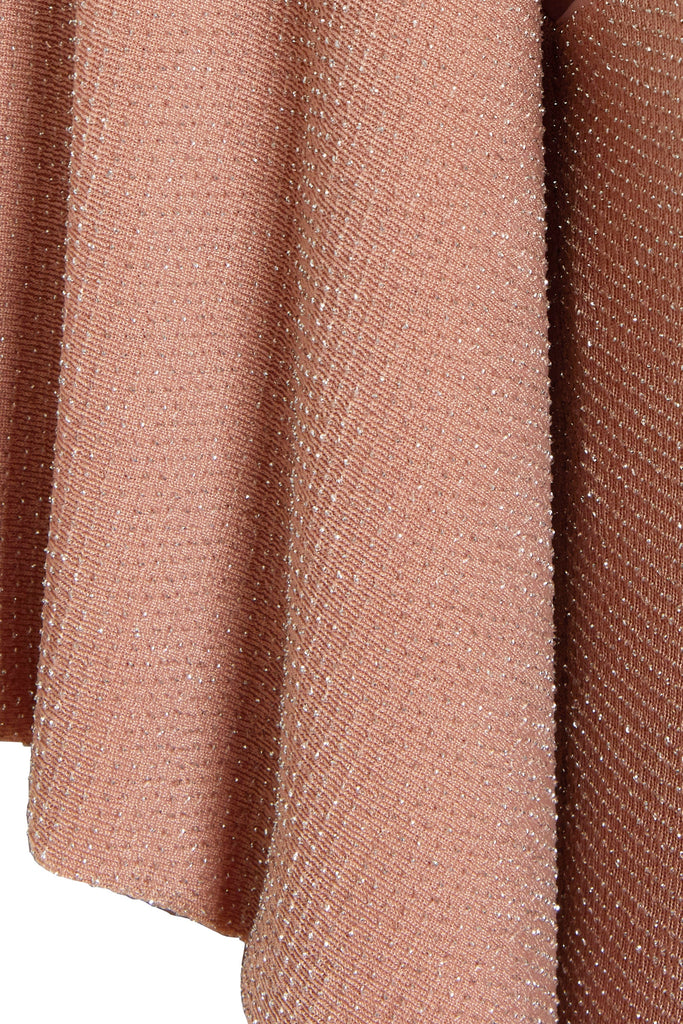 a close up of a Mocha Backless Maxi Dress with ruffles by Sarvin.