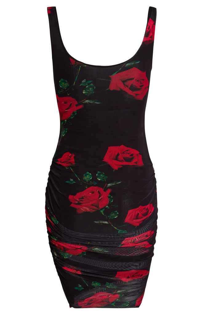 a Sarvin Ruched Bodycon Dress with red roses on it.